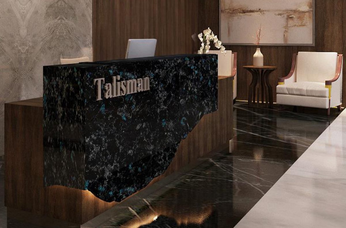 Talisman reception, District 8 SCBD - marble desk and walnut panelling
